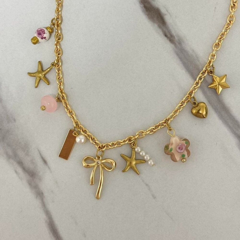 SKU:0043 Gold tone charm necklace with pearls heart star and bow‎ charms